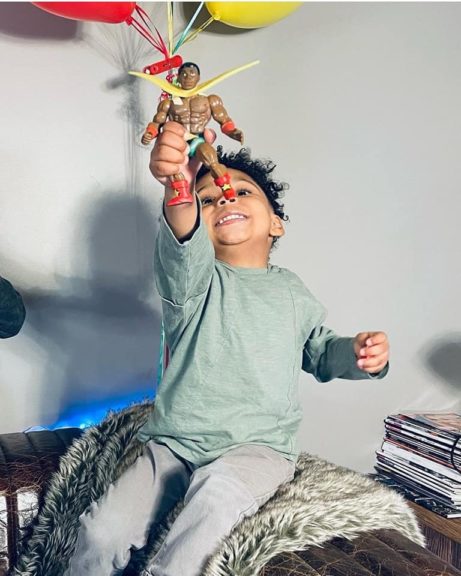 A child plays with Sun-Man action figure