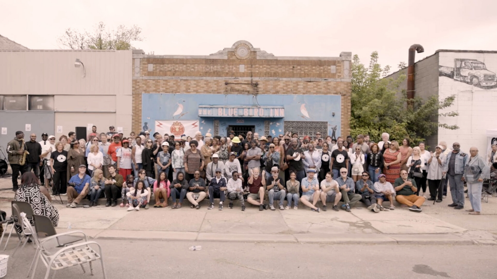 Community members in front of the Blue Bird Inn in Detroit