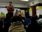 Birdie's Bookmobile founder Alyce Hartman reads to a class of students at Voyageur Academy in Southwest Detroit.