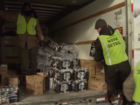 Disaster crews work to give out free water bottle to residents in the aftermath of the Flint water crisis
