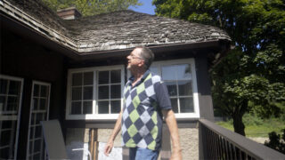 Indian Village resident Mark Reynolds shows off his house's American Thatch roof.